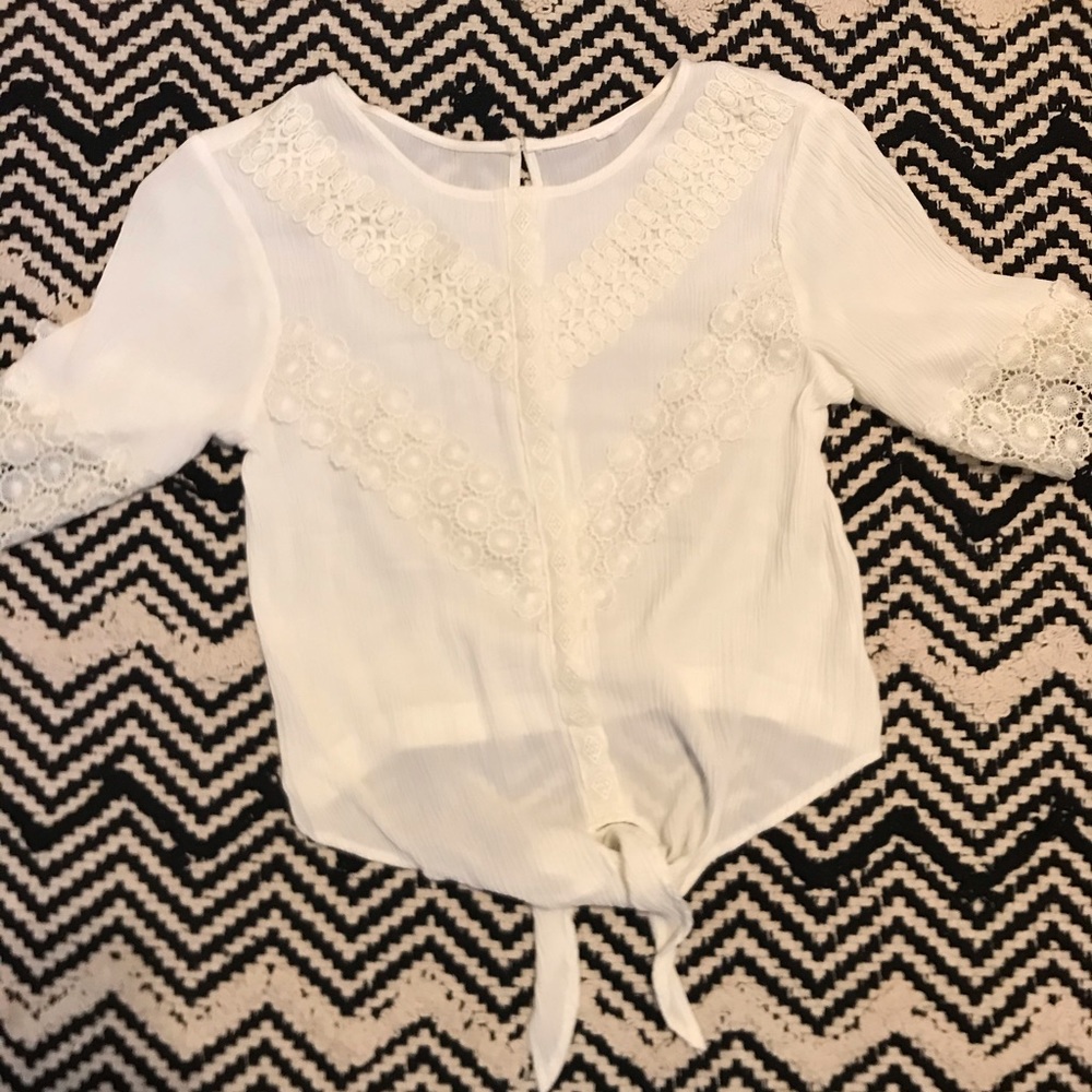 Embroidered off-white peasant top with tie.